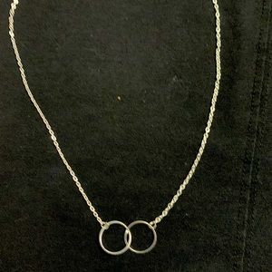 Silver choker style necklace. 14 inch chain. Lobster claw clasp.